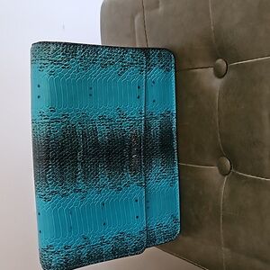 Micheal Kors turquoise and black clutch